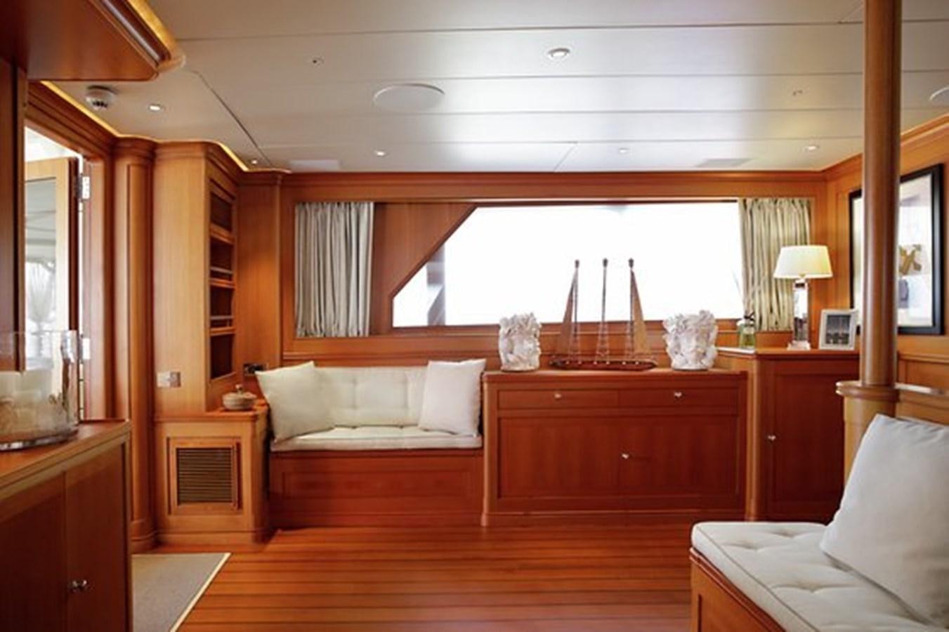 a bedroom with a bed and a window aboard LA LUNA Yacht for Sale