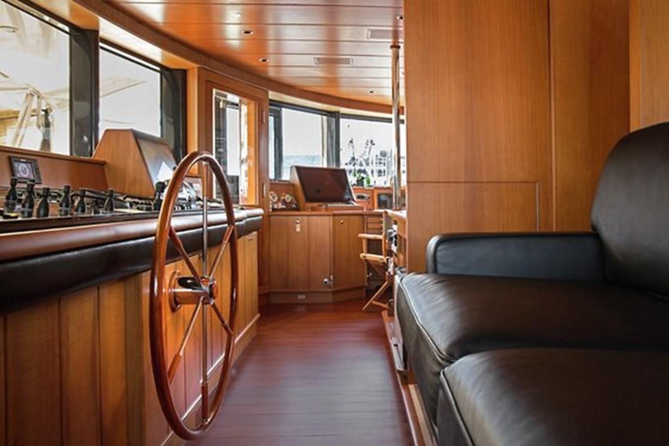 a room with a piano and a couch aboard LA LUNA Yacht for Sale