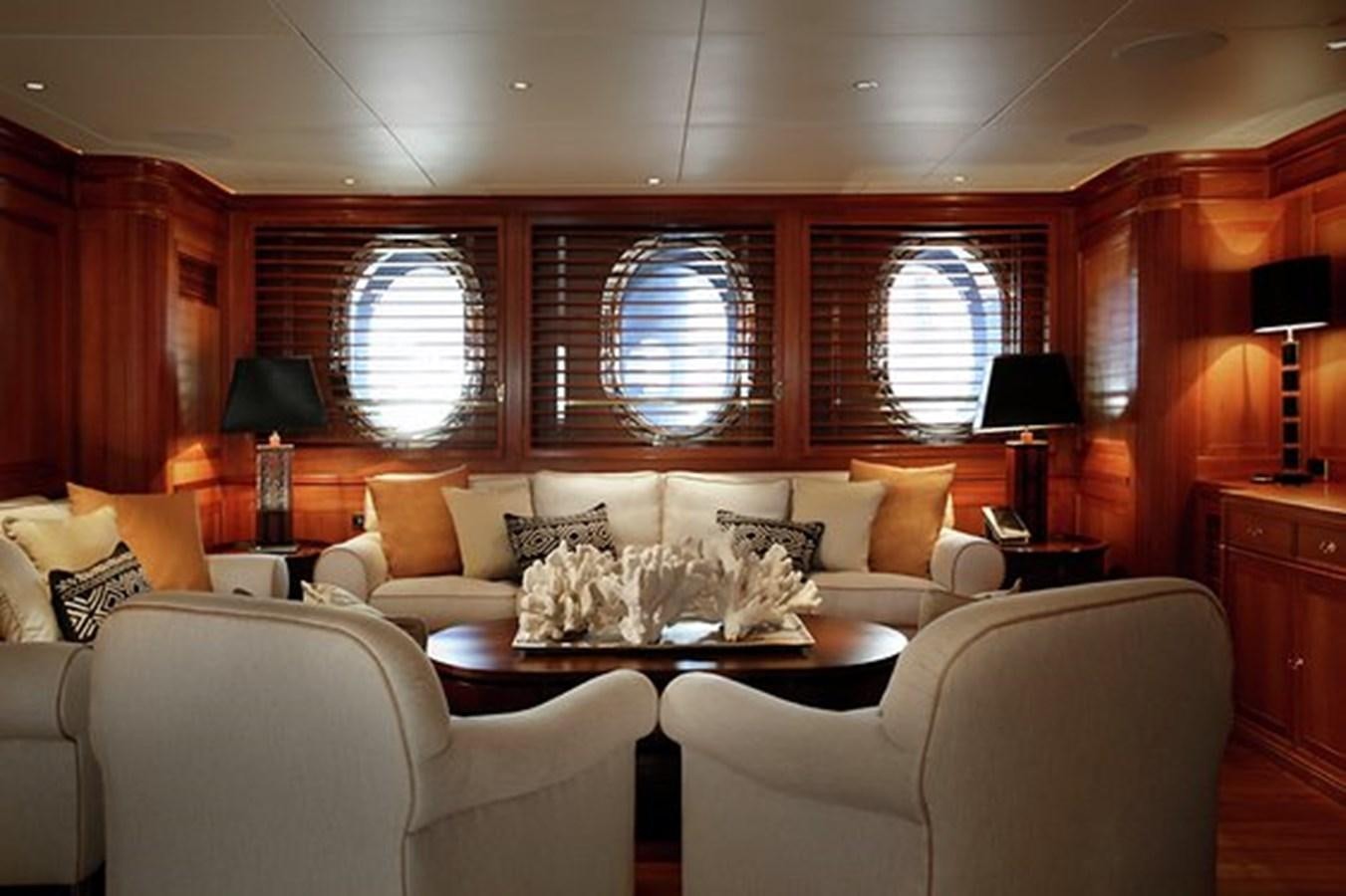a living room with a couch and a table aboard LA LUNA Yacht for Sale