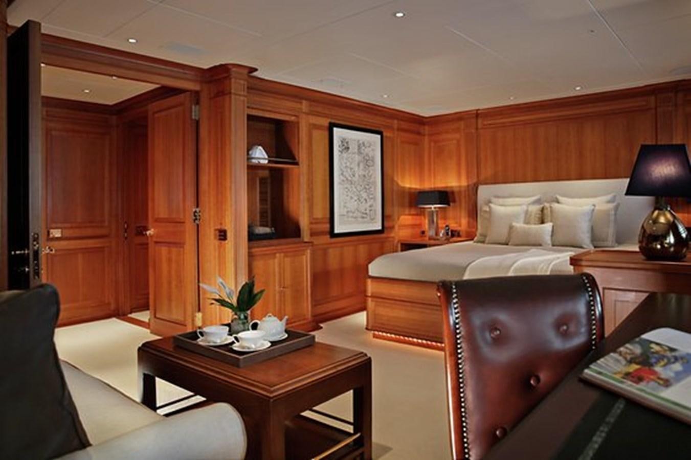 a room with a bed and a table aboard LA LUNA Yacht for Sale