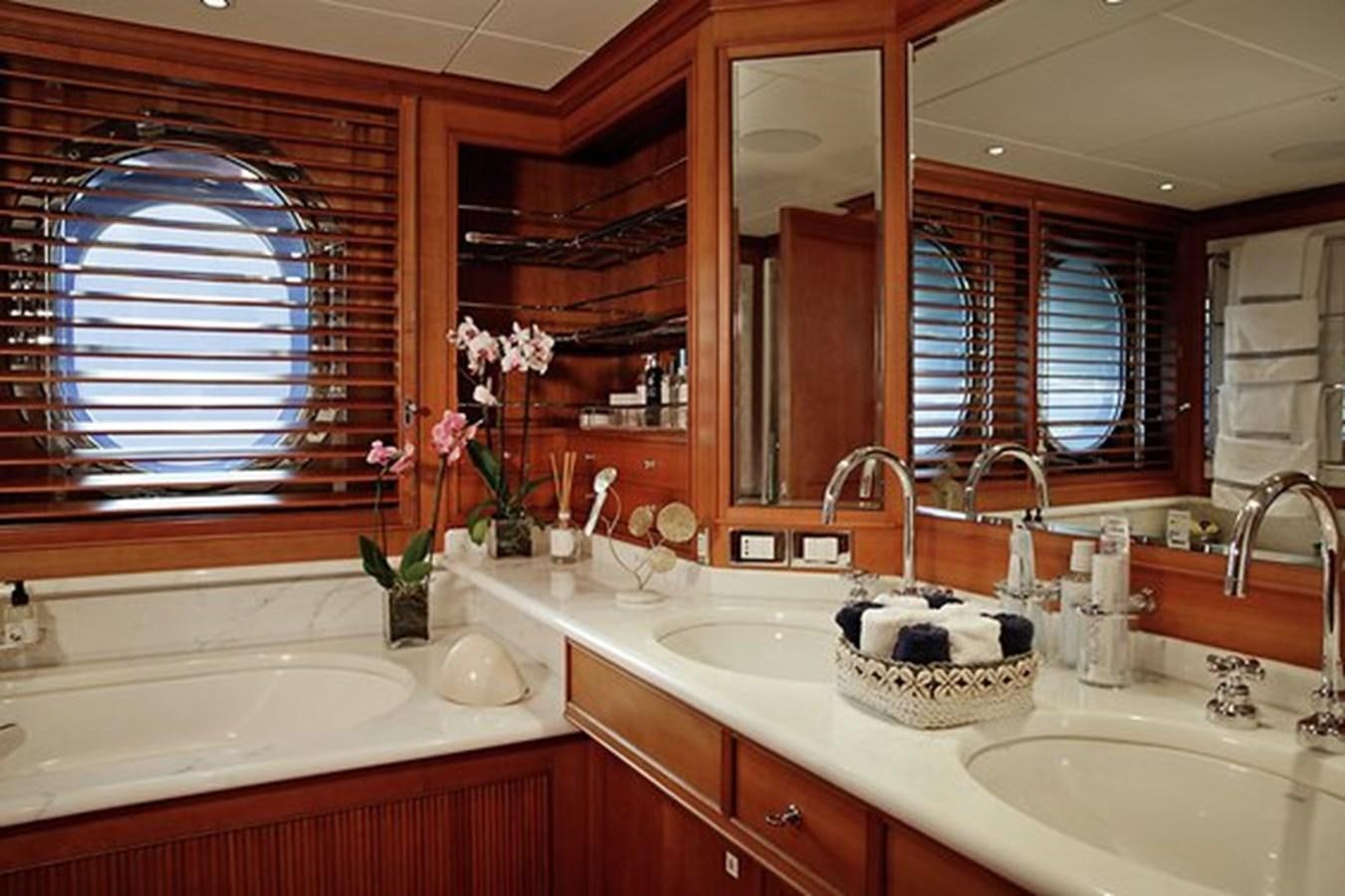 a bathroom with a sink and a mirror aboard LA LUNA Yacht for Sale