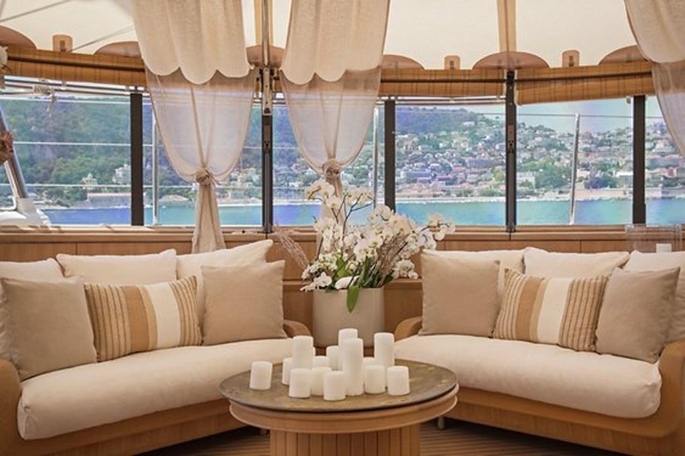 a living room with a large window aboard LA LUNA Yacht for Sale