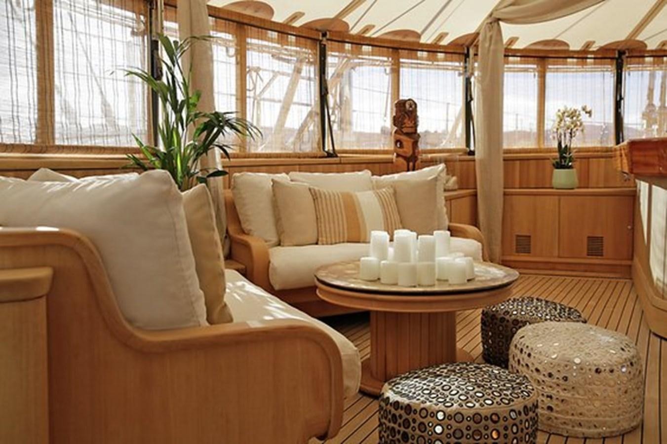 a room with a table and chairs aboard LA LUNA Yacht for Sale