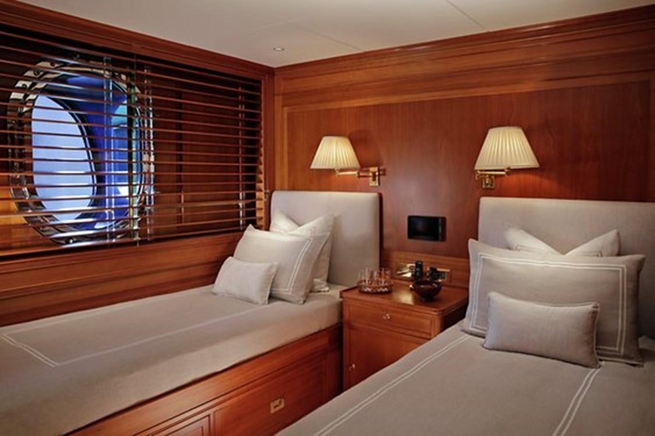 a room with a bed and a window aboard LA LUNA Yacht for Sale