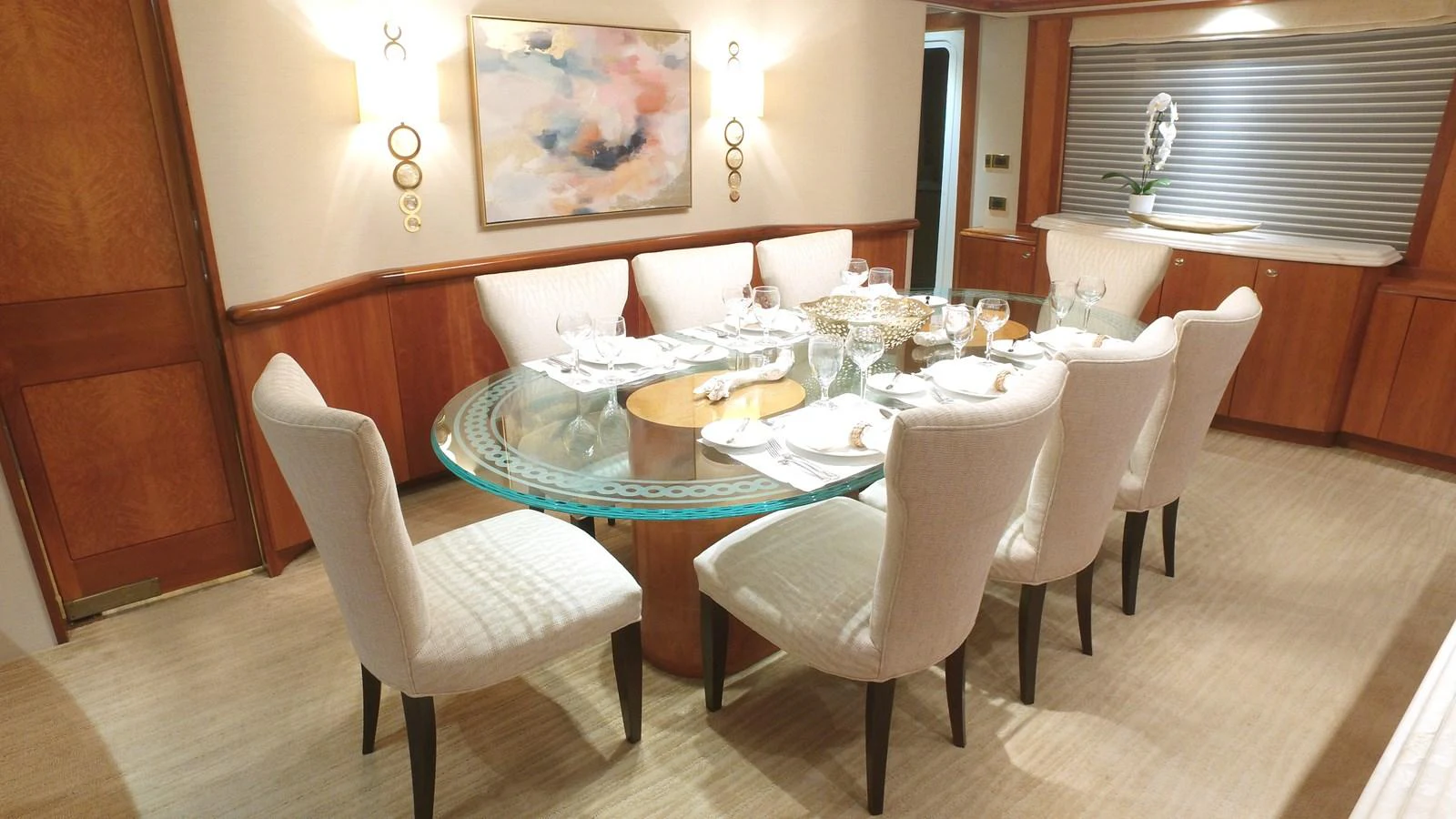 a table set with plates and chairs aboard SHORT GAME Yacht for Sale