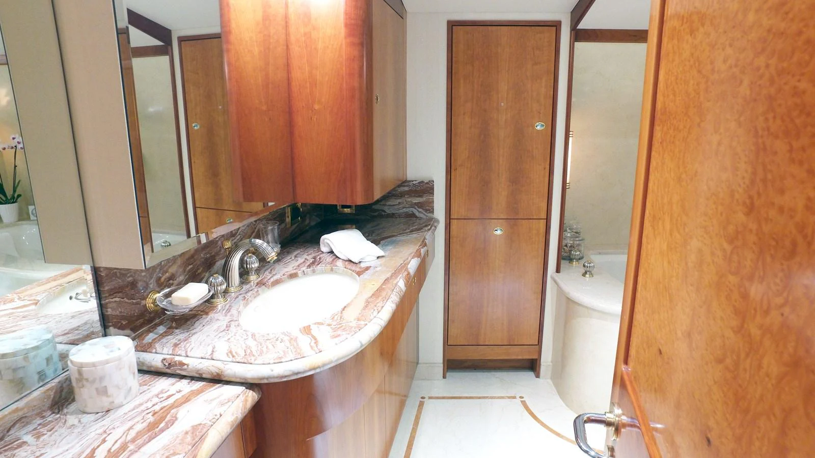 a bathroom with a sink and bathtub aboard SHORT GAME Yacht for Sale