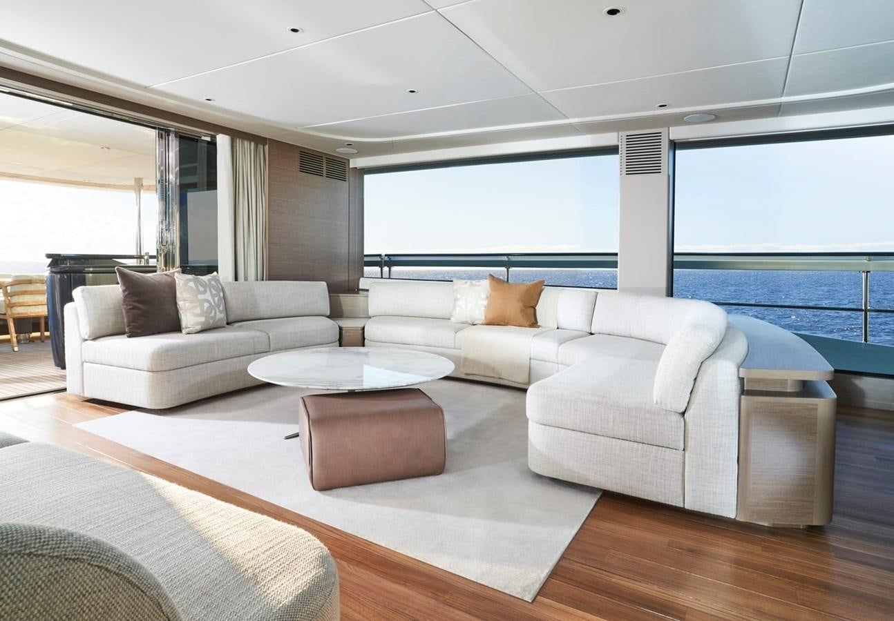 a living room with a large window aboard ROVAL Yacht for Sale