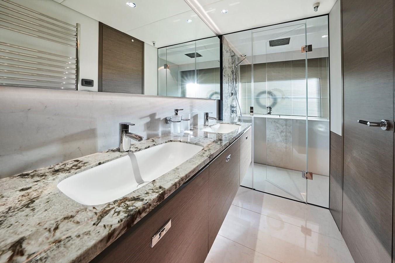 a bathroom with a marble counter top aboard ROVAL Yacht for Sale