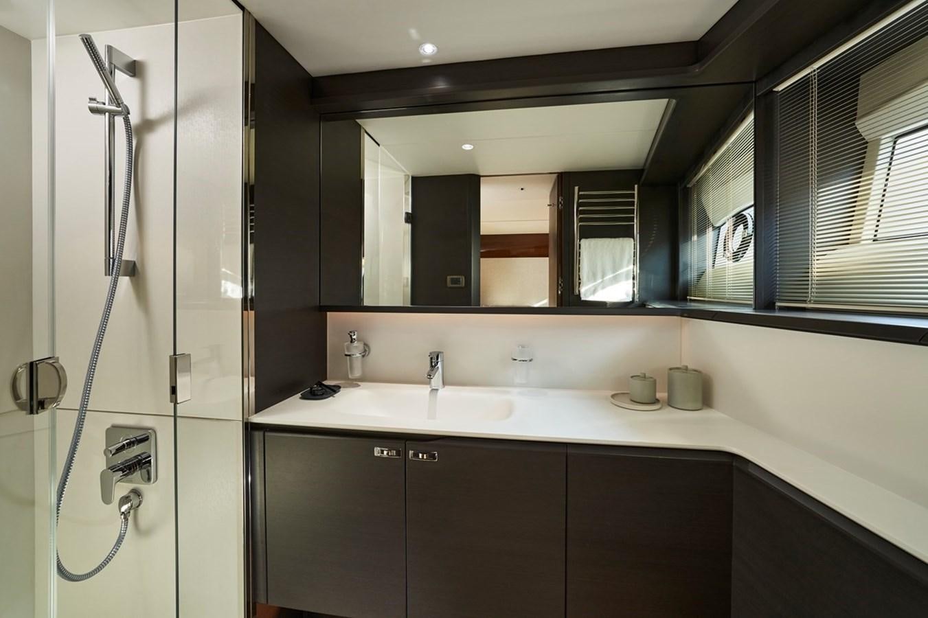 a bathroom with a shower unit and sink aboard ROVAL Yacht for Sale