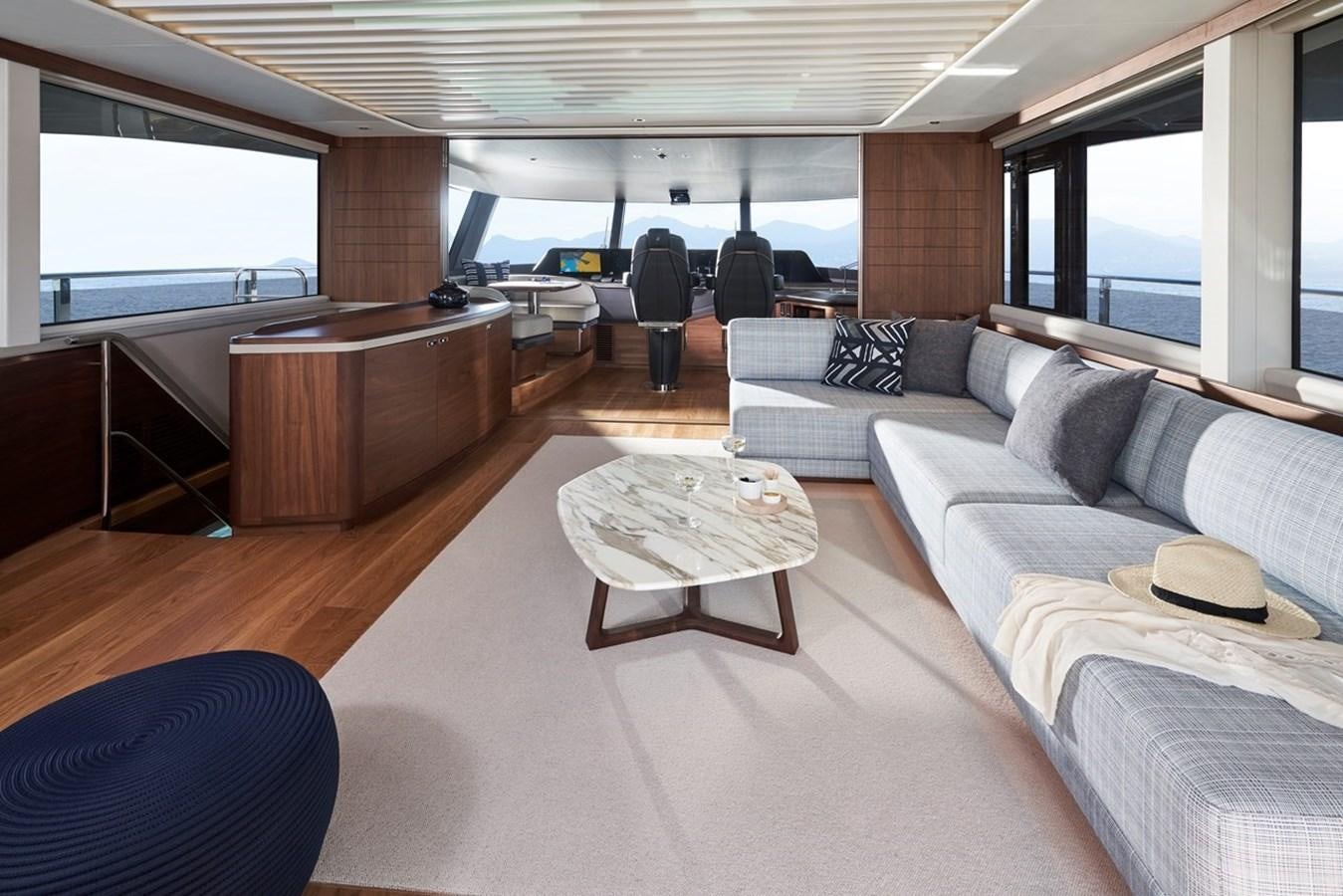 a living room with a couch and a coffee table aboard ROVAL Yacht for Sale