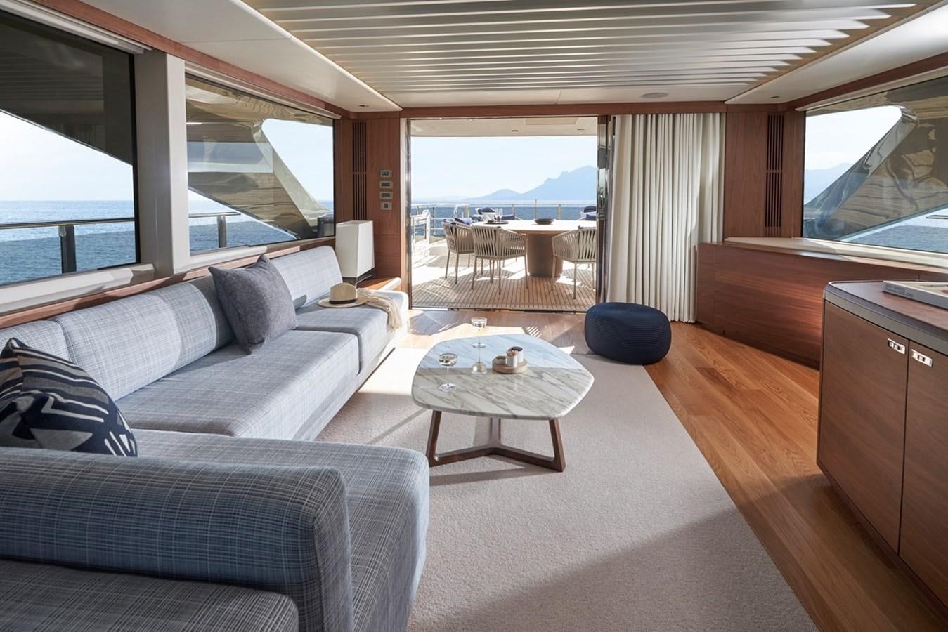 a living room with a large window aboard ROVAL Yacht for Sale