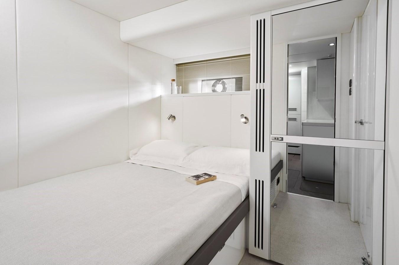 a bed in a room aboard ROVAL Yacht for Sale