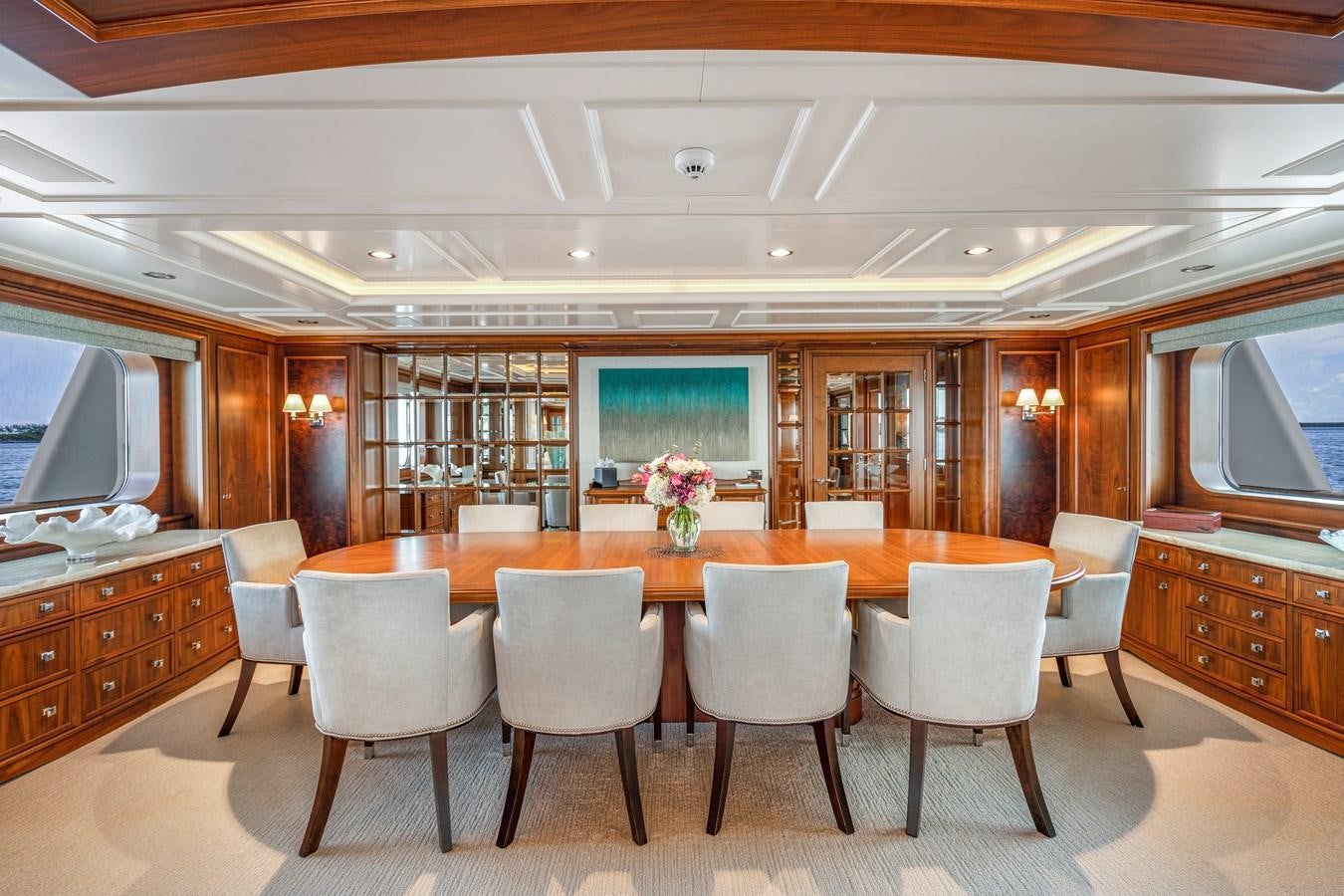 a large kitchen with a table and chairs aboard BIG EASY Yacht for Charter
