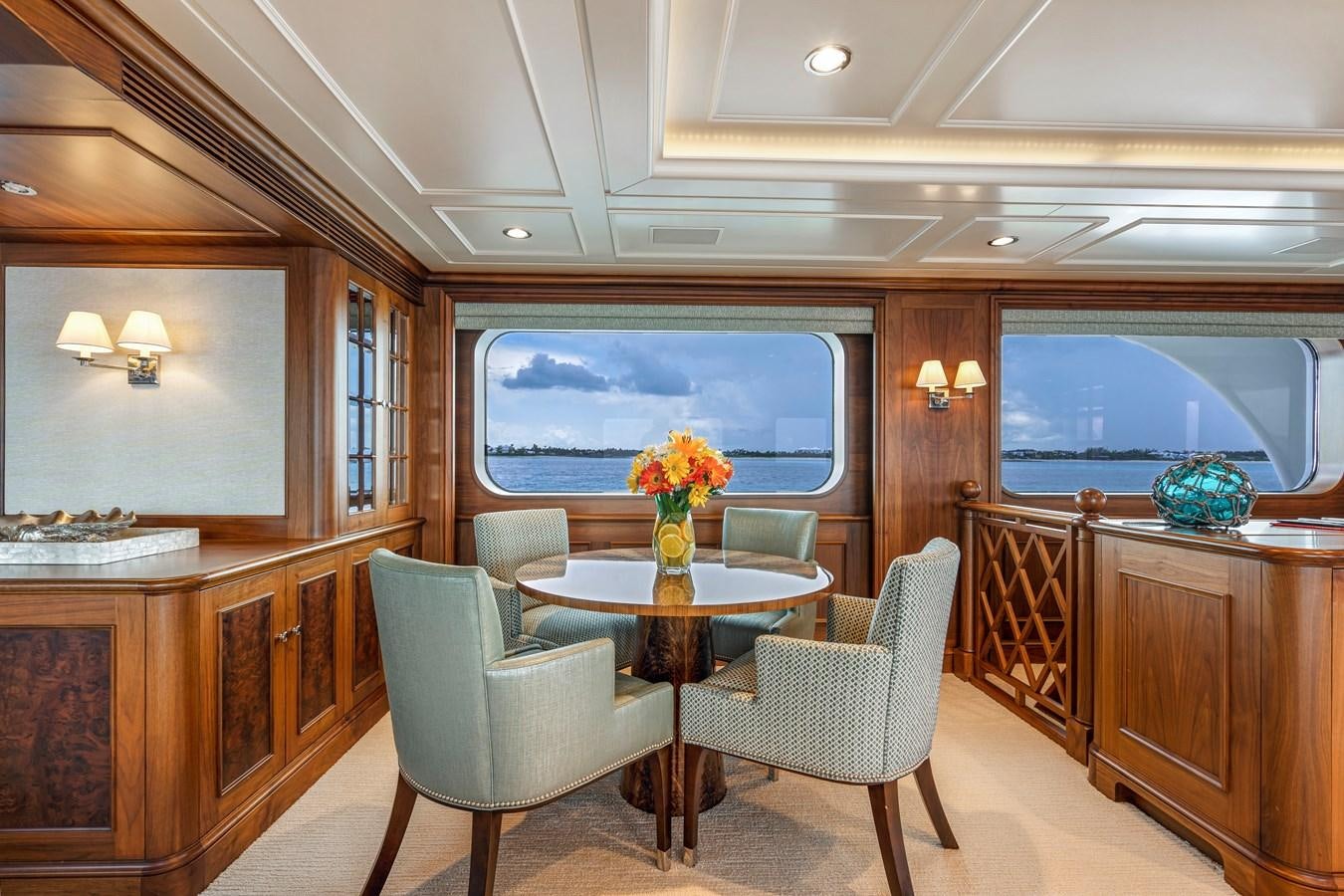 a dining room with a table and chairs aboard BIG EASY Yacht for Charter