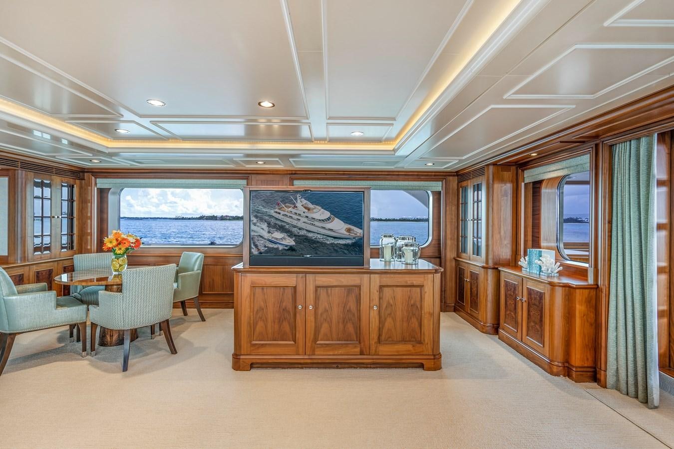 a room with a table and chairs aboard BIG EASY Yacht for Charter