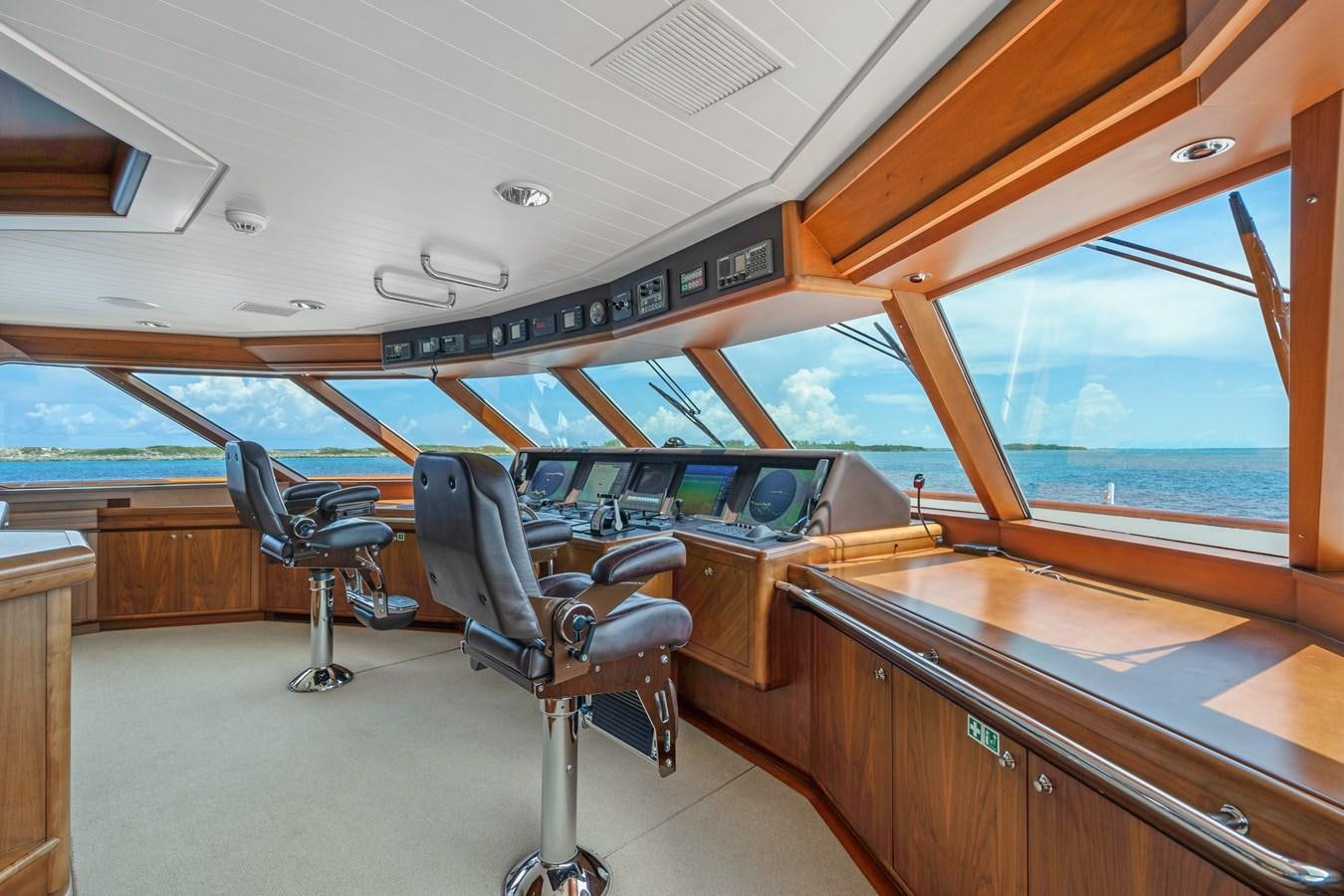 a room with a table and chairs aboard BIG EASY Yacht for Charter