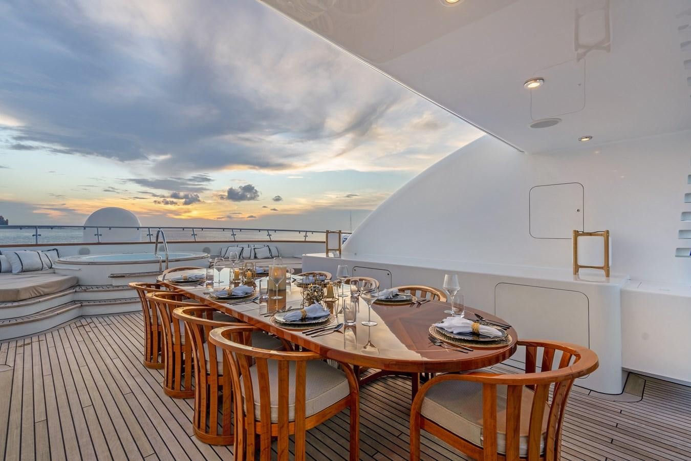 a dining table on a deck aboard BIG EASY Yacht for Charter