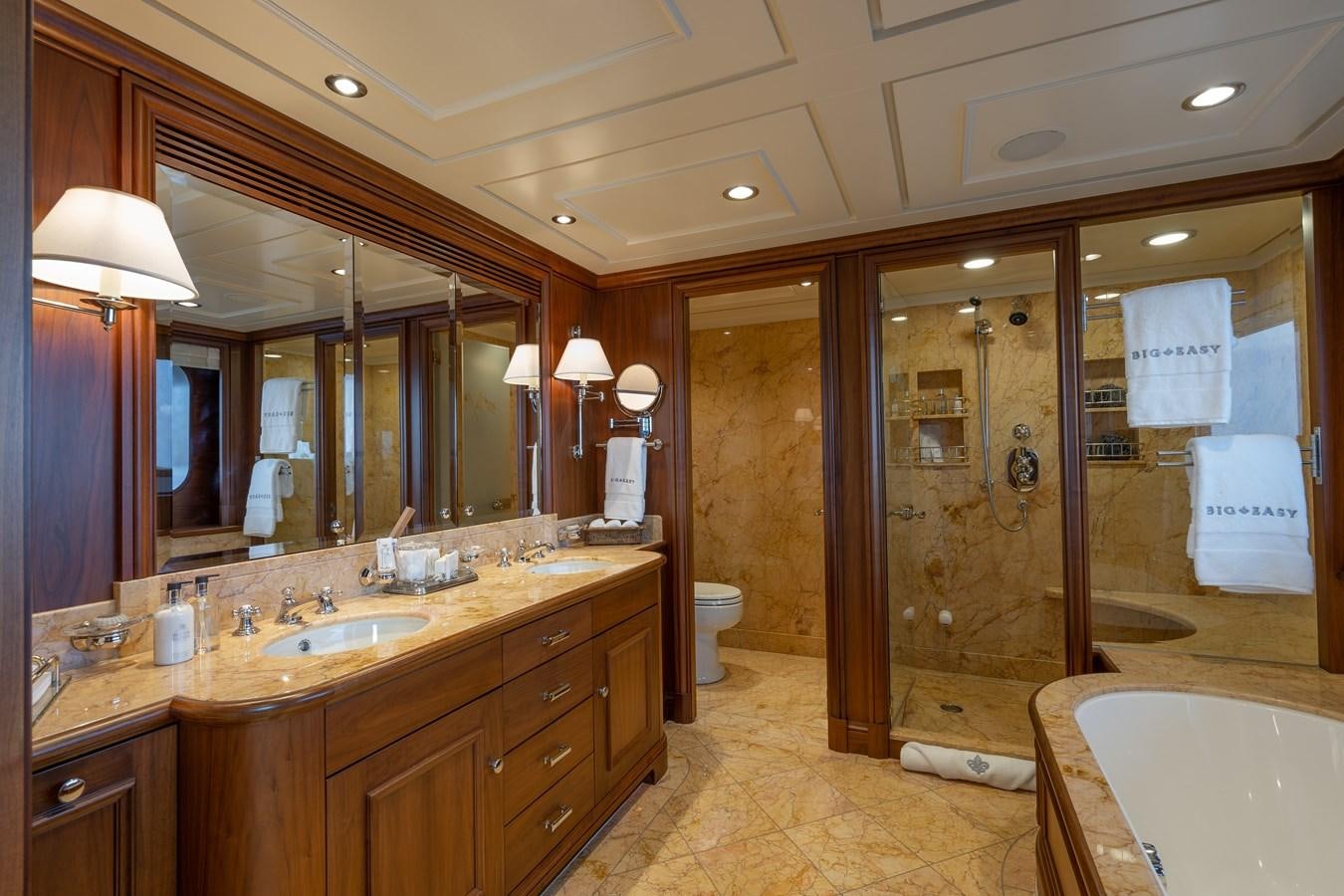 a bathroom with a large mirror aboard BIG EASY Yacht for Charter
