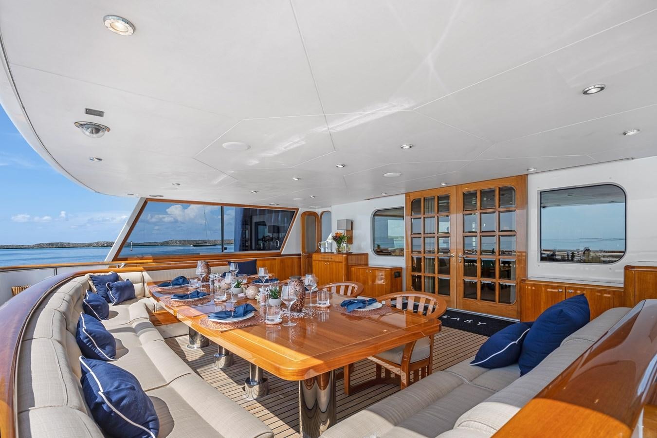a room with a table and chairs aboard BIG EASY Yacht for Charter
