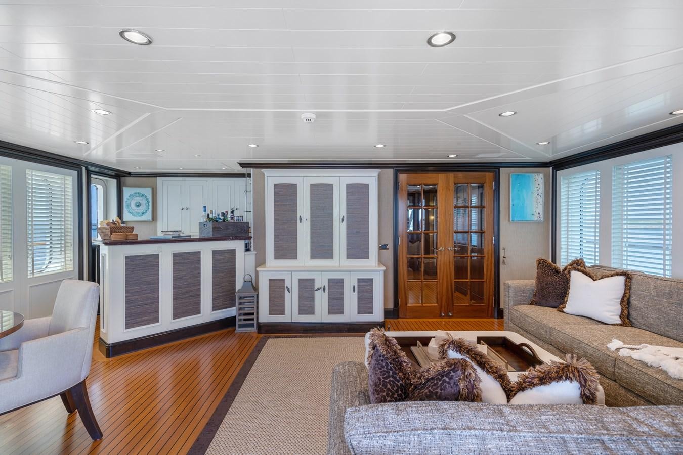 a living room with a couch and a coffee table aboard BIG EASY Yacht for Charter