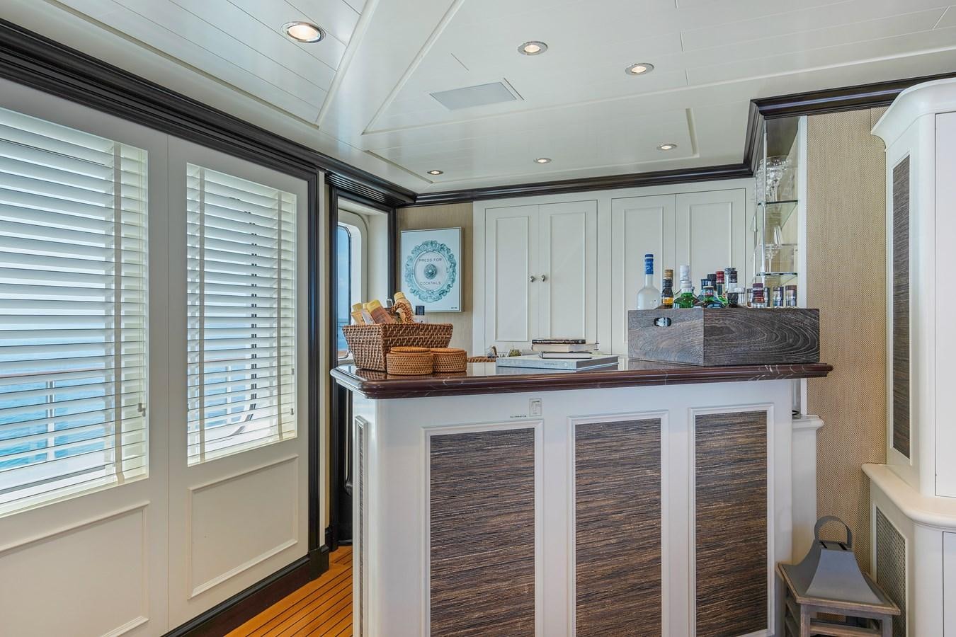 a kitchen with white cabinets aboard BIG EASY Yacht for Charter