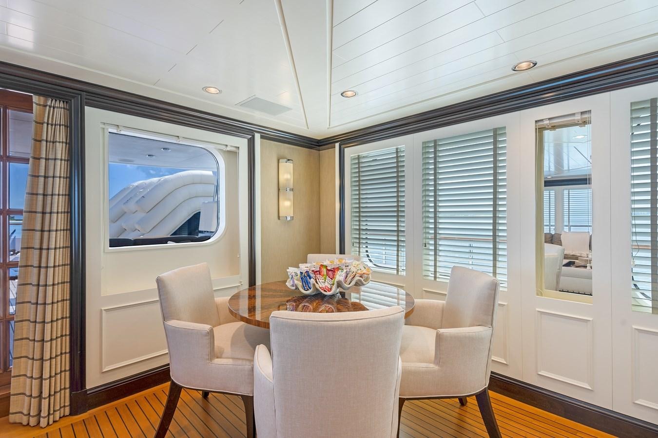 a living room with a tv aboard BIG EASY Yacht for Charter