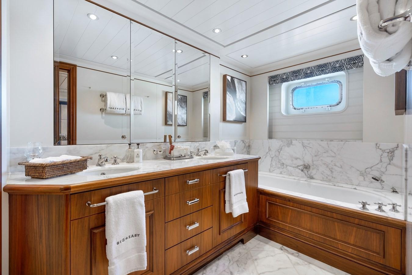 a bathroom with a large mirror aboard BIG EASY Yacht for Charter