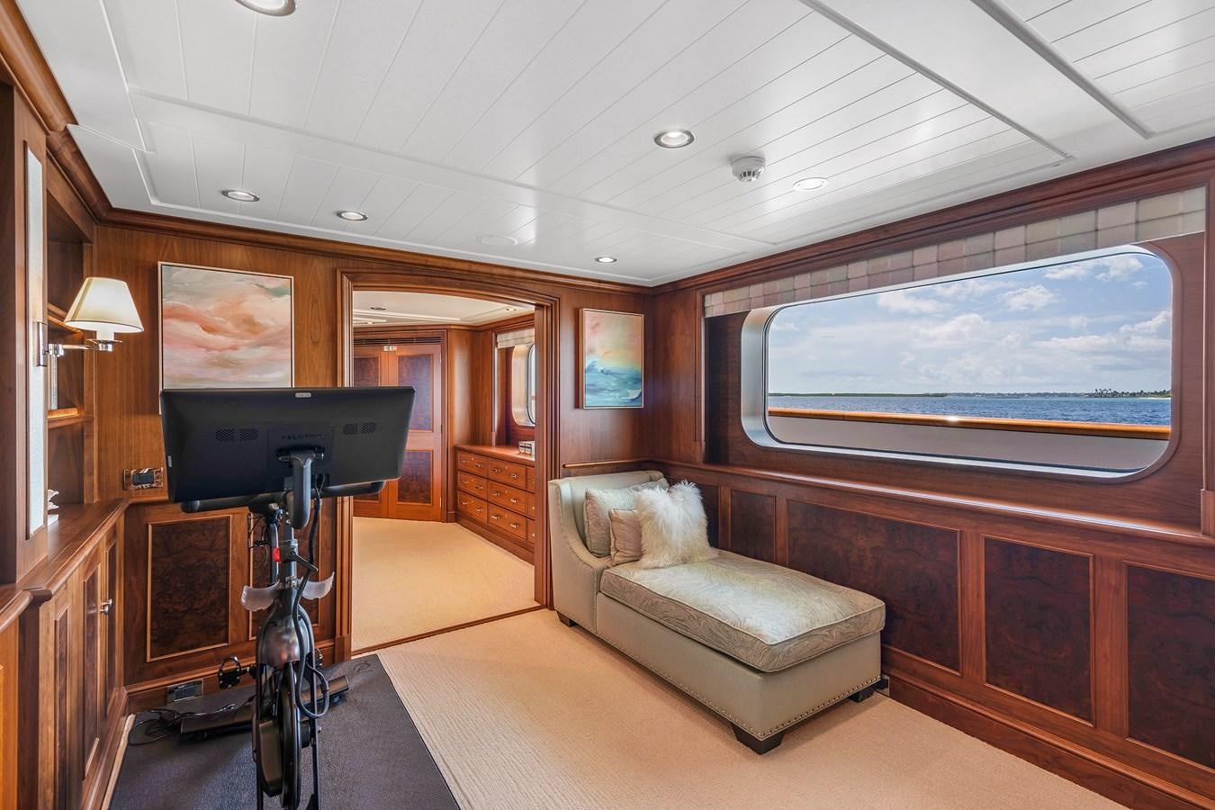 a living room with a large television and a couch aboard BIG EASY Yacht for Charter