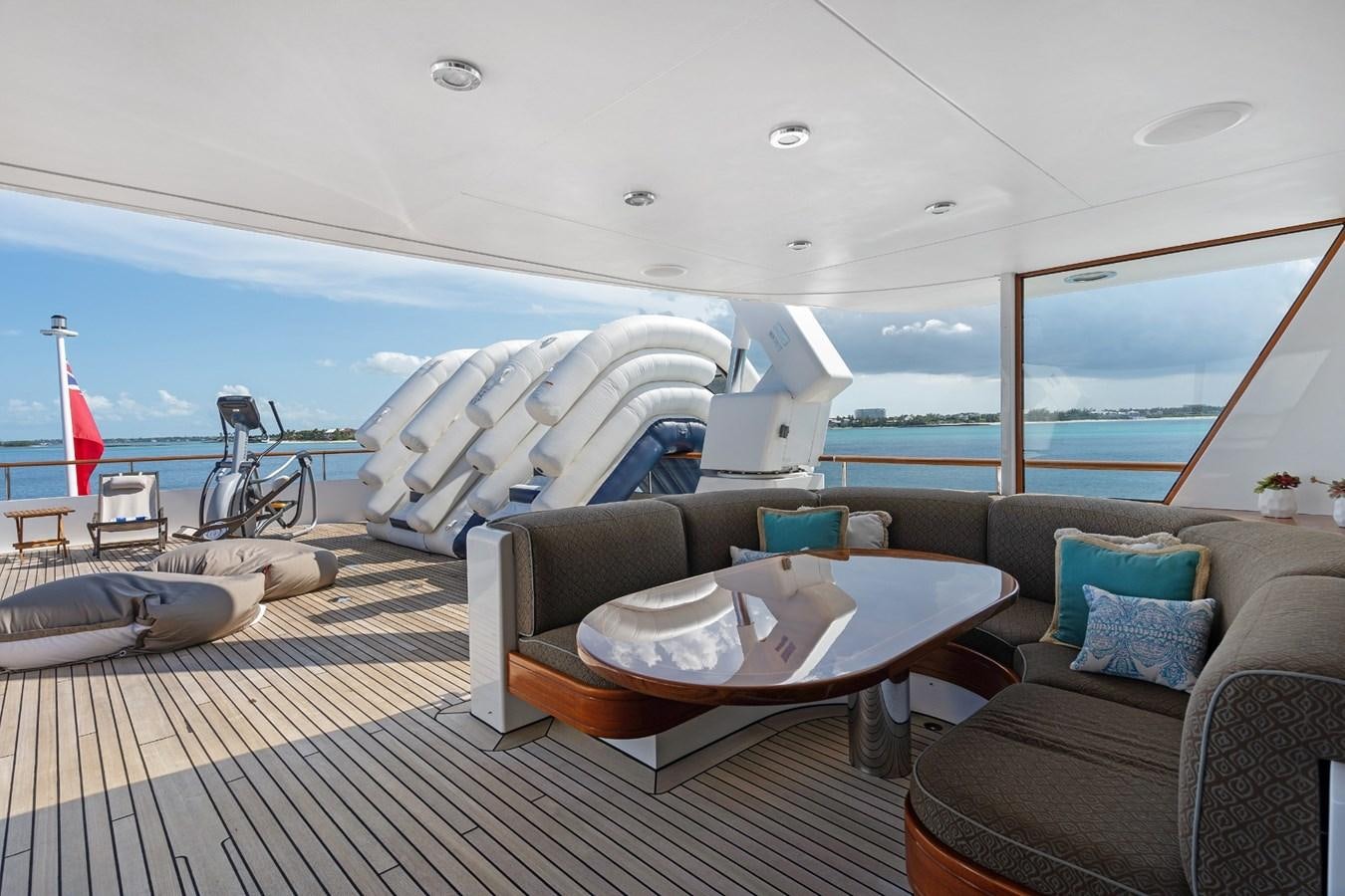 a room with a bed and a couch aboard BIG EASY Yacht for Charter