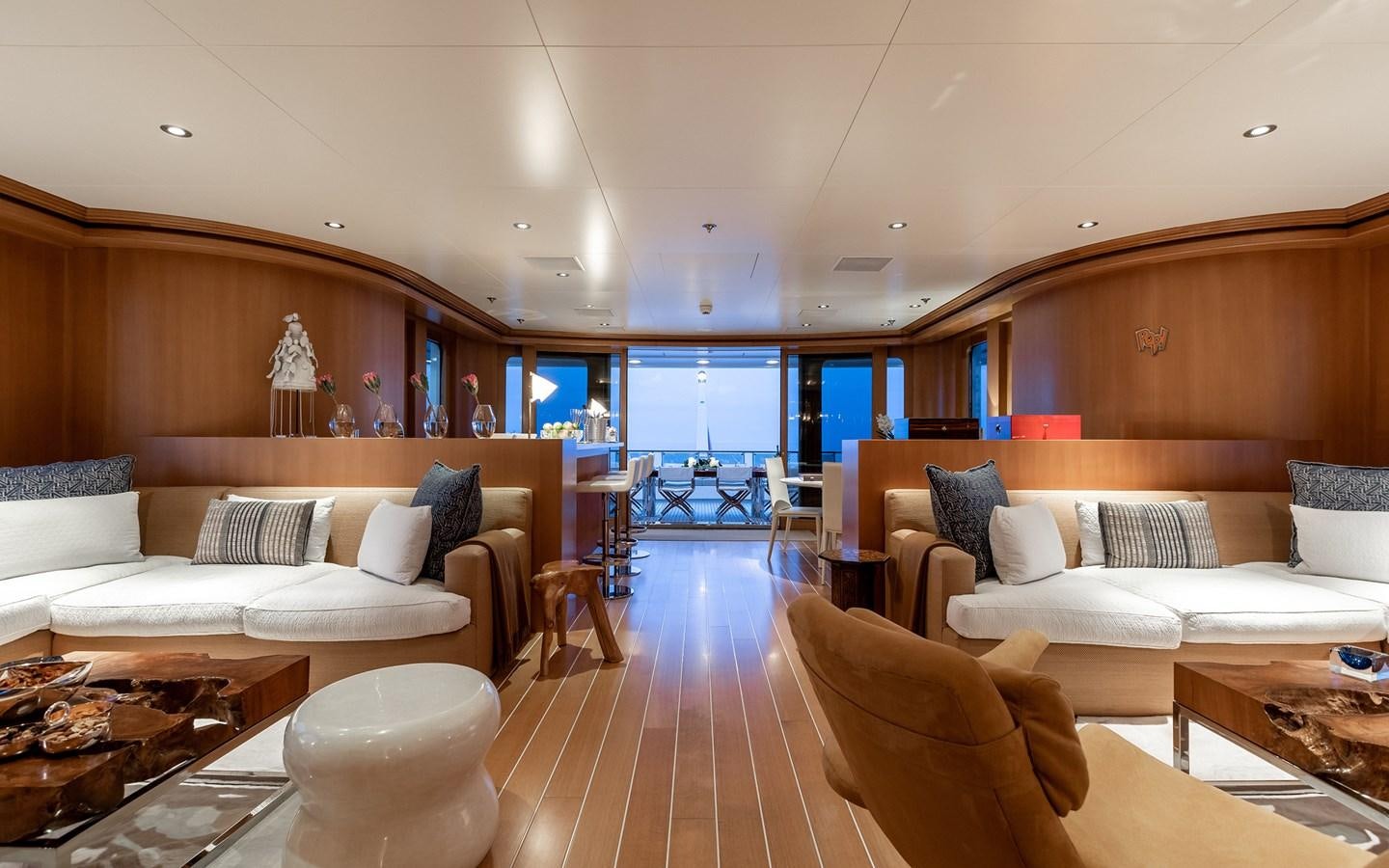 a living room with a couch and a table aboard TREEHOUSE Yacht for Sale