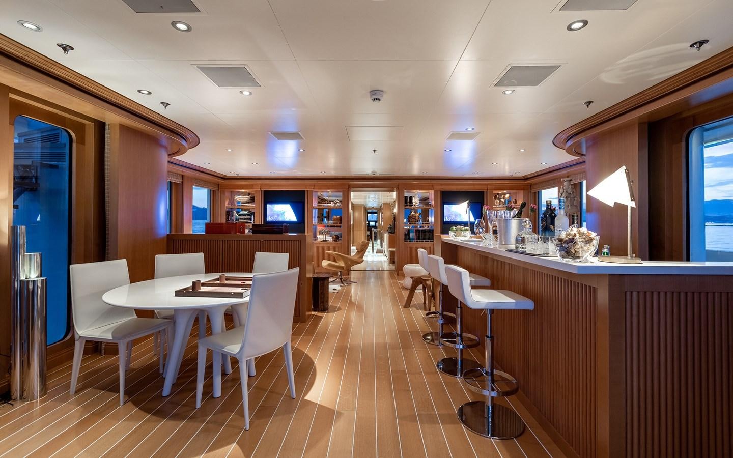 a room with tables and chairs aboard TREEHOUSE Yacht for Sale