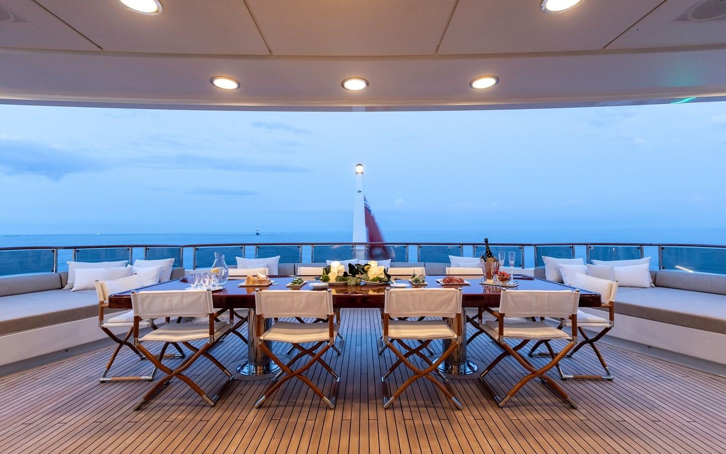 a room with a table and chairs aboard TREEHOUSE Yacht for Sale