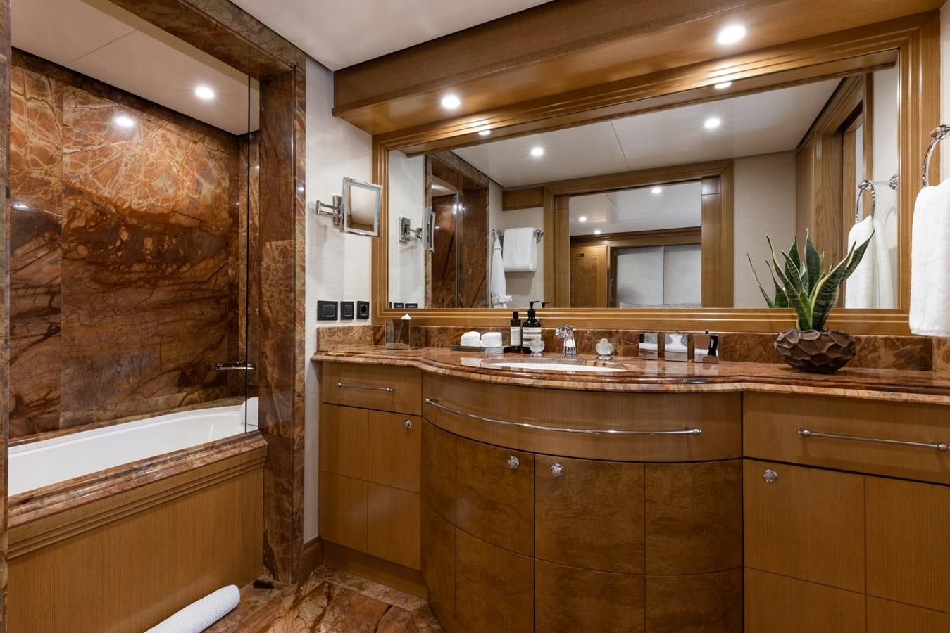a bathroom with a large mirror aboard TREEHOUSE Yacht for Sale