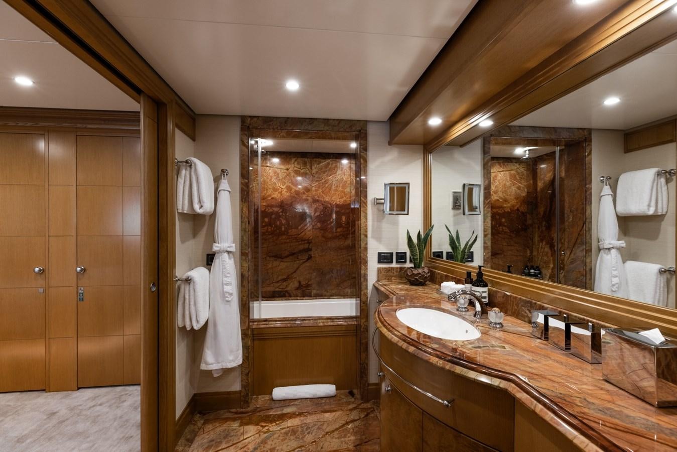 a bathroom with a large mirror aboard TREEHOUSE Yacht for Sale