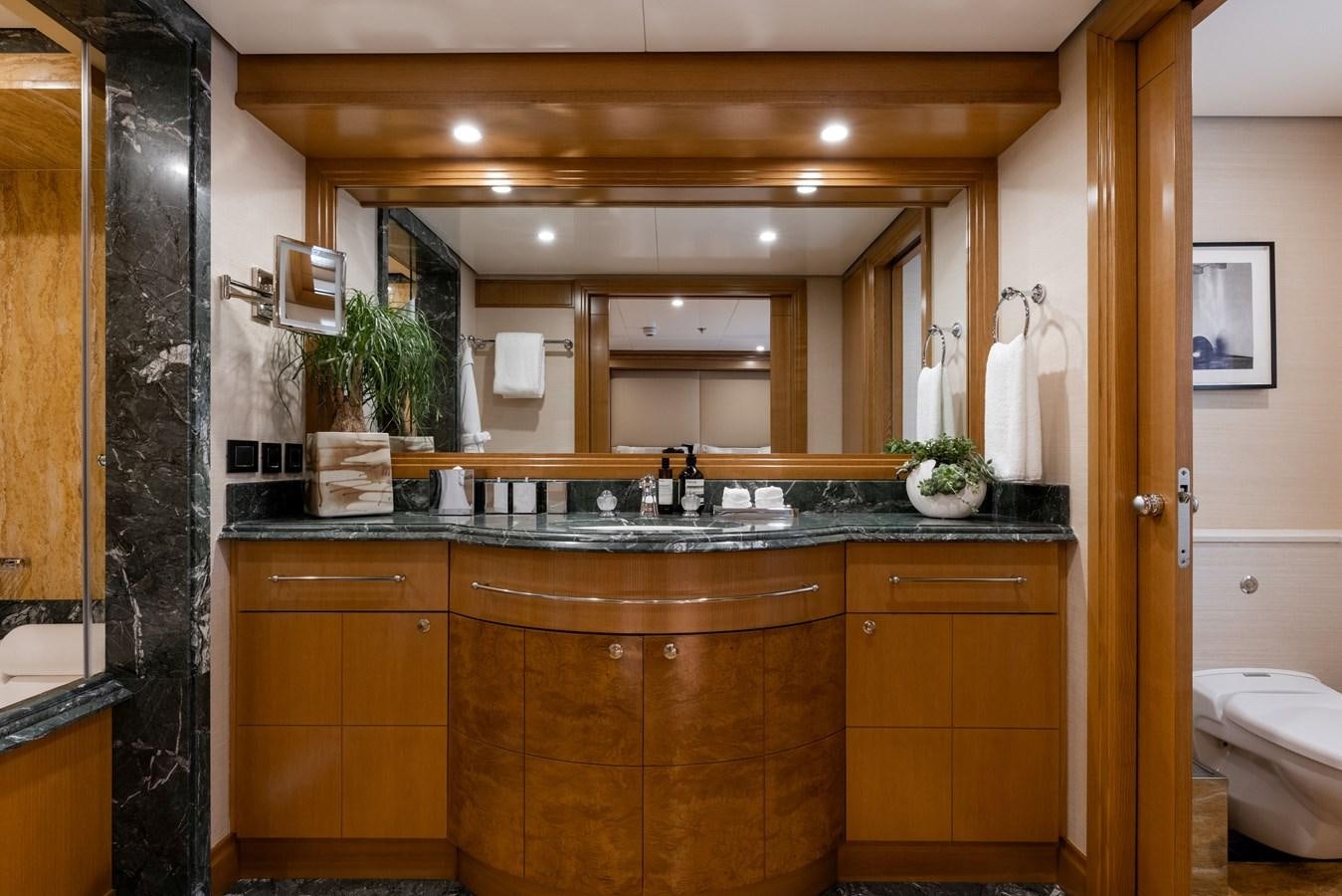 a bathroom with a sink and a mirror aboard TREEHOUSE Yacht for Sale
