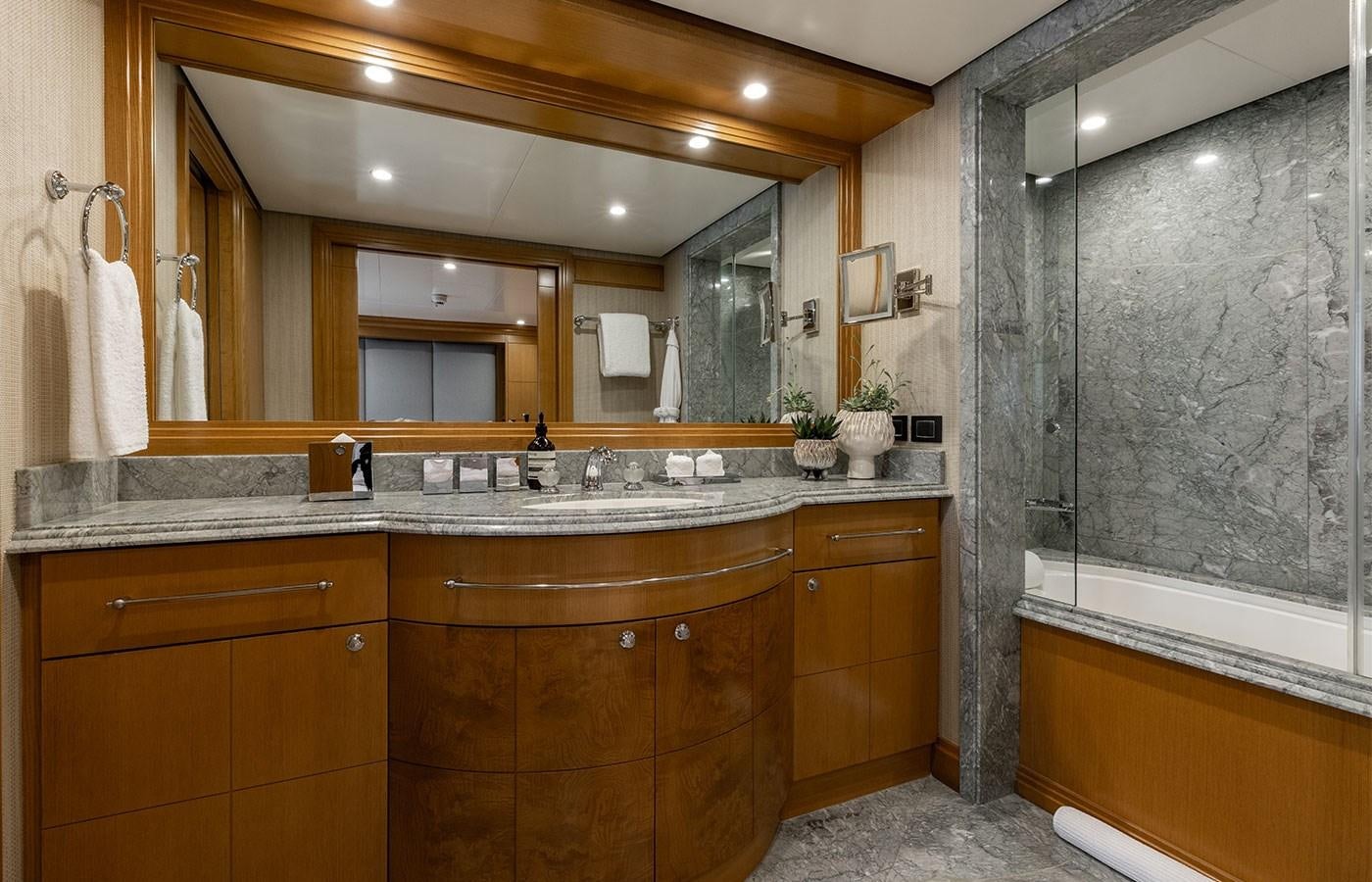 a bathroom with a large mirror aboard TREEHOUSE Yacht for Sale