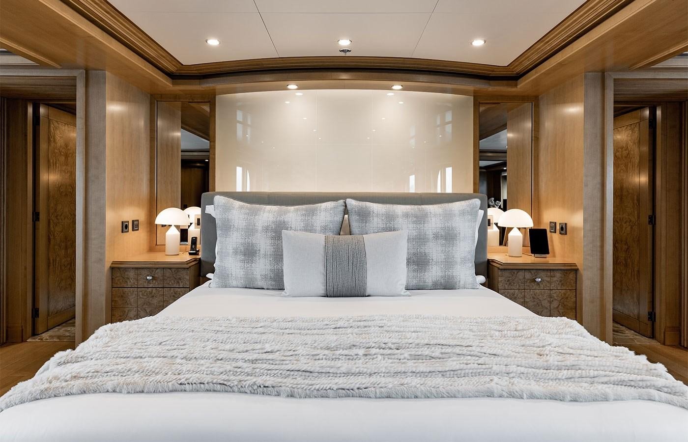 a bed with white sheets aboard TREEHOUSE Yacht for Sale