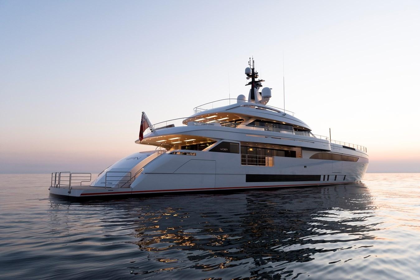 a large white boat on the water aboard STERN Yacht for Sale
