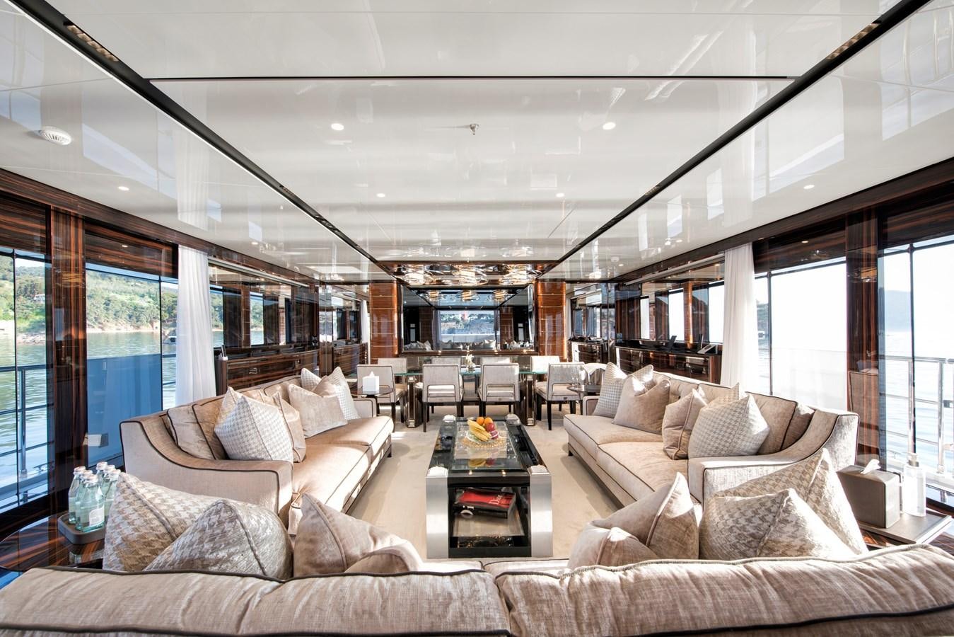 a living room with a large window aboard STERN Yacht for Sale