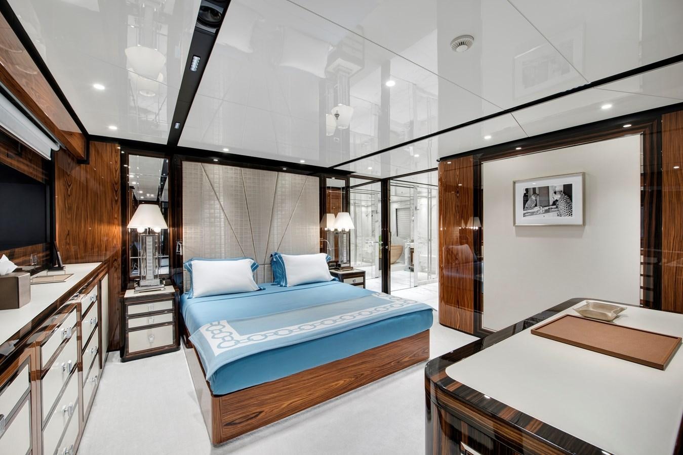 a room with a bed and a desk aboard STERN Yacht for Sale