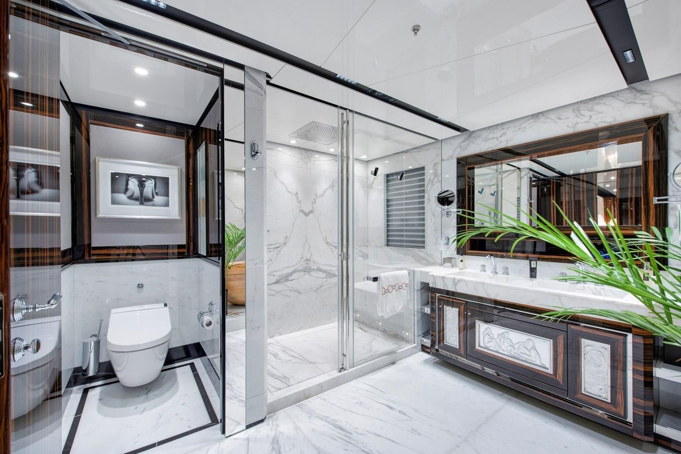 a bathroom with a glass shower aboard STERN Yacht for Sale