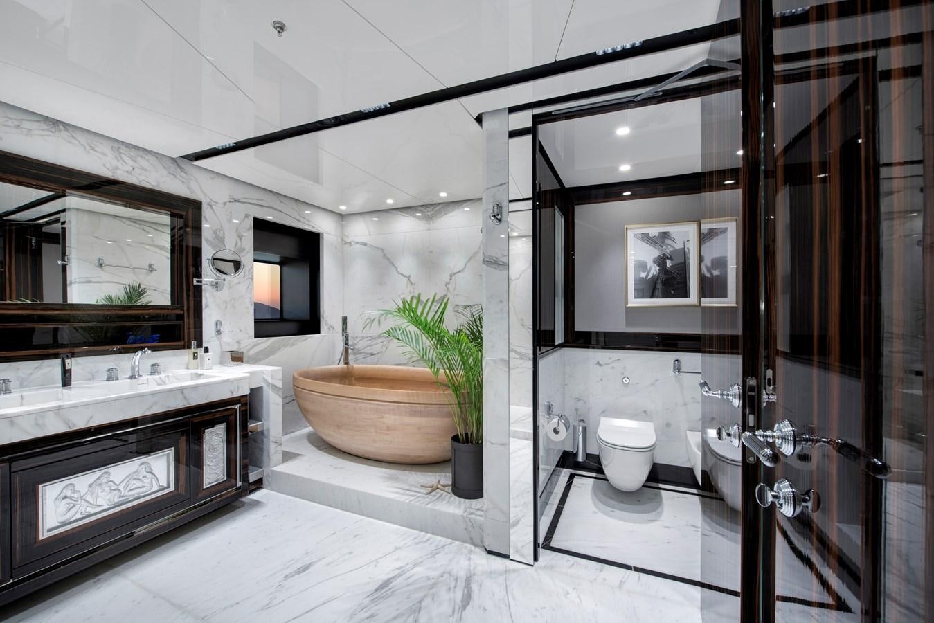 a bathroom with a tub sink and toilet aboard STERN Yacht for Sale