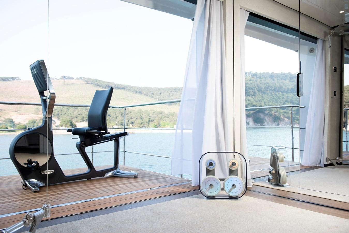 a deck with a large window aboard STERN Yacht for Sale