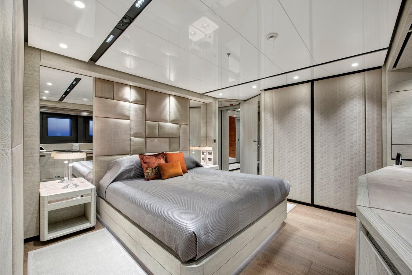 a large bedroom with a bed aboard STERN Yacht for Sale