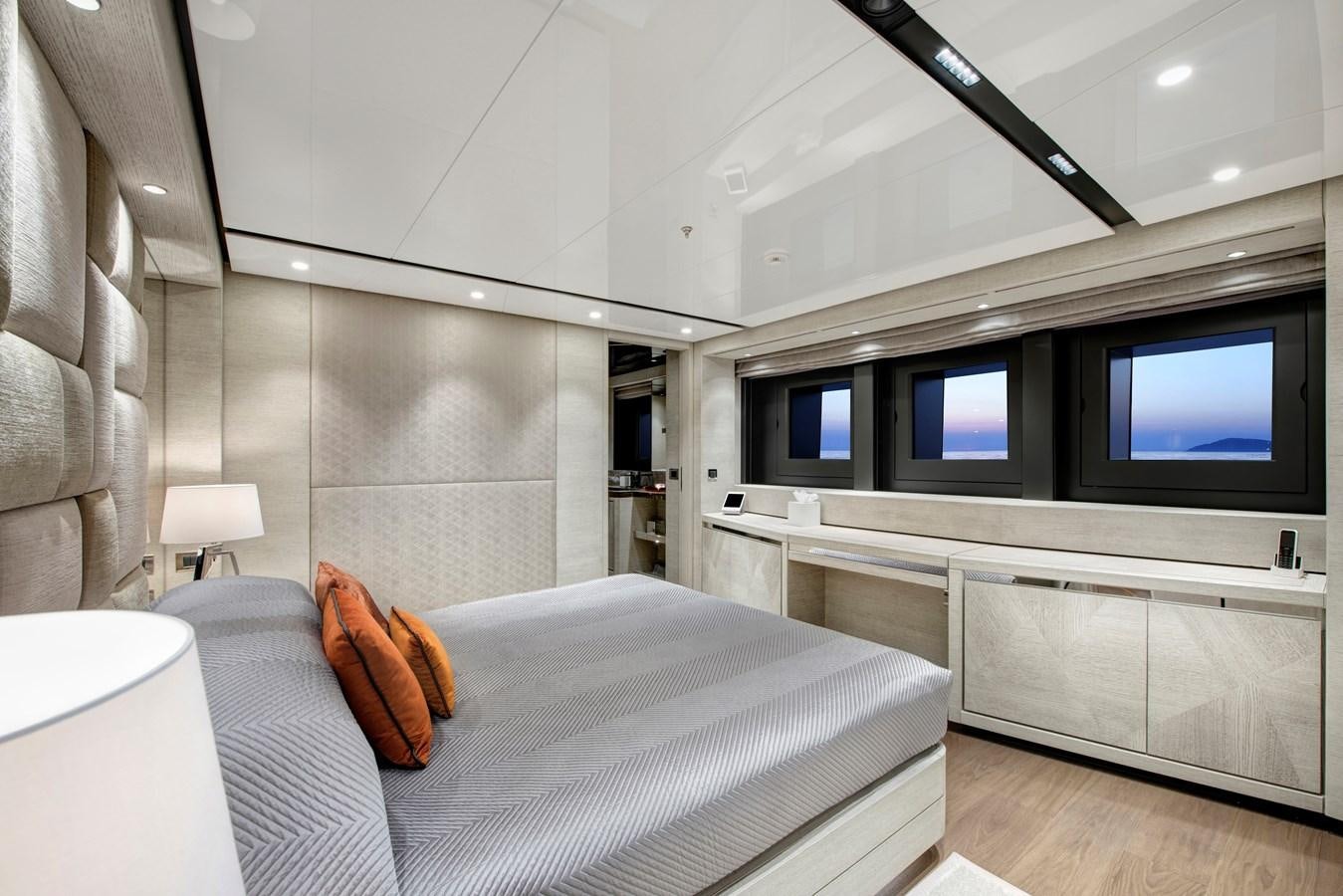 a bedroom with a bed and a tv aboard STERN Yacht for Sale