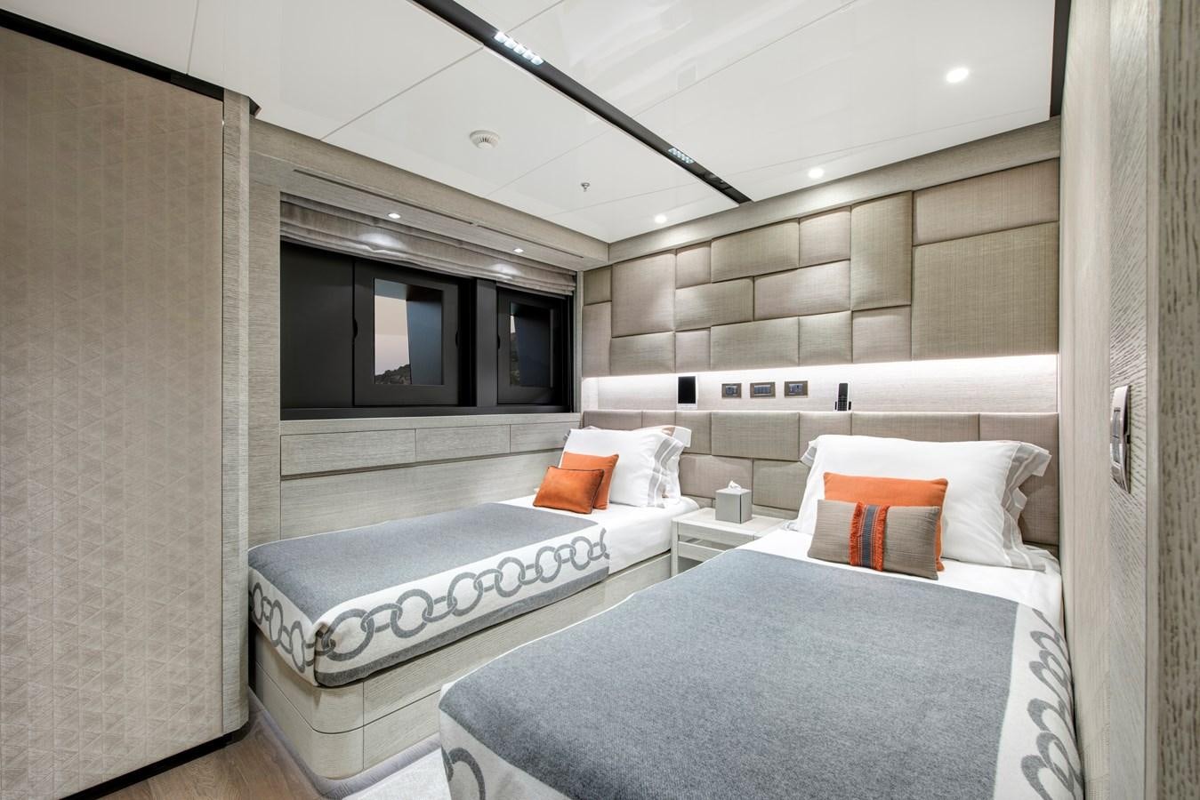a room with two beds aboard STERN Yacht for Sale