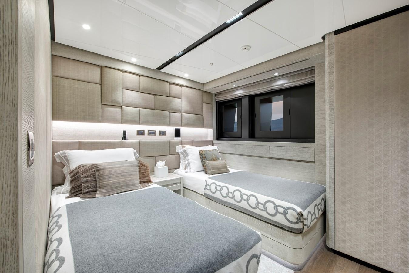 a room with a bed and a large mirror aboard STERN Yacht for Sale