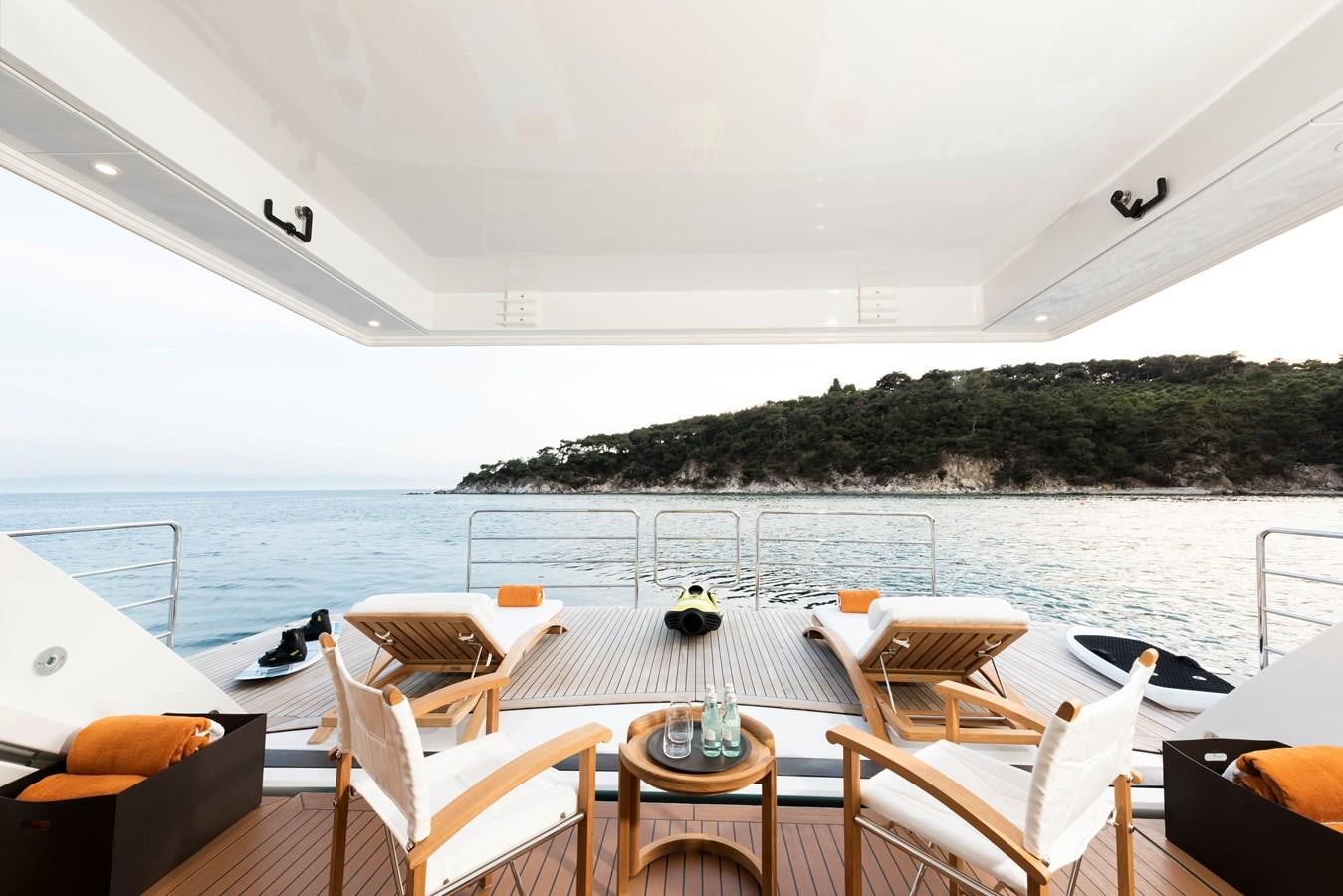 a table and chairs on a boat aboard STERN Yacht for Sale