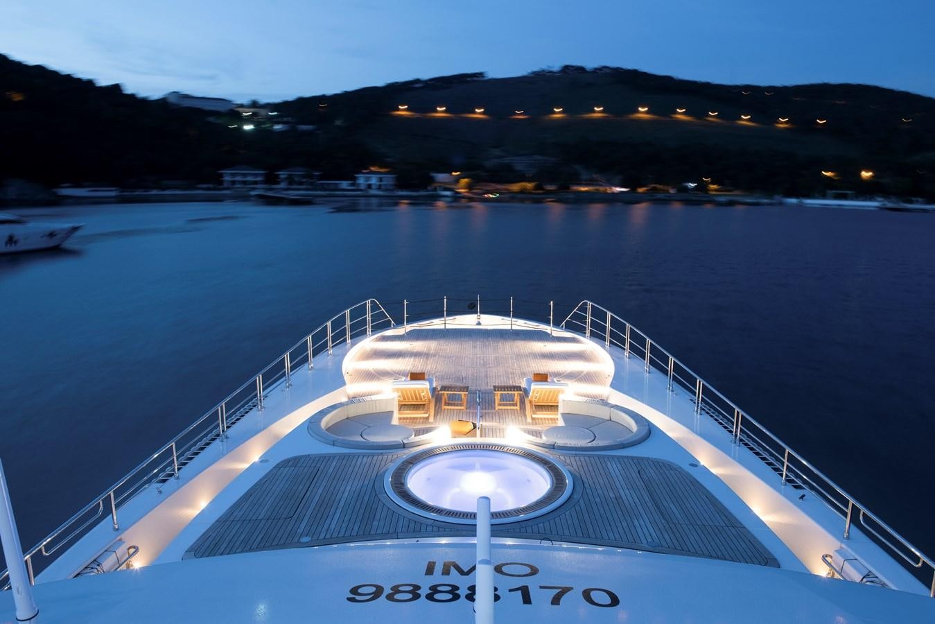 a large white swimming pool aboard STERN Yacht for Sale