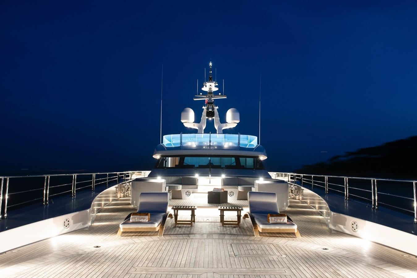 a large blue boat on a dock aboard STERN Yacht for Sale